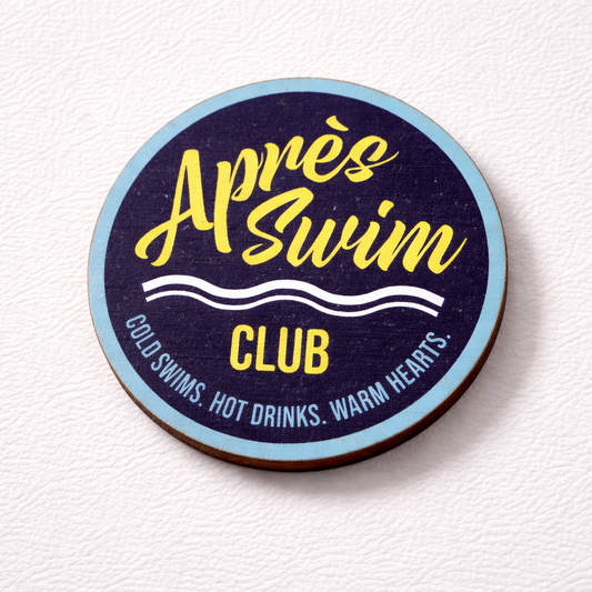 Fridge magnet with 'Apres Swim Club' text on a textured white background